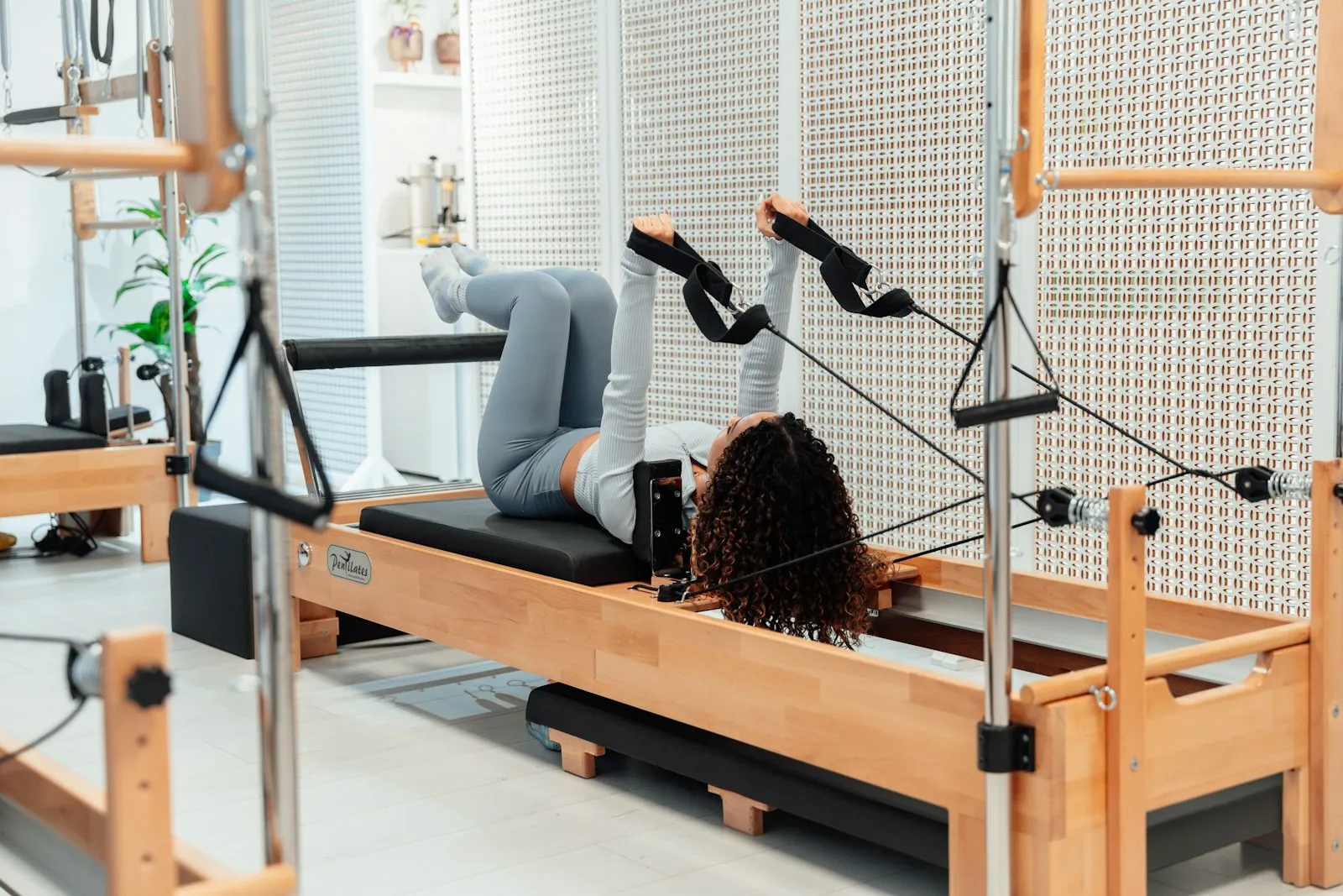Close up of a reformer carriage, straps and springs